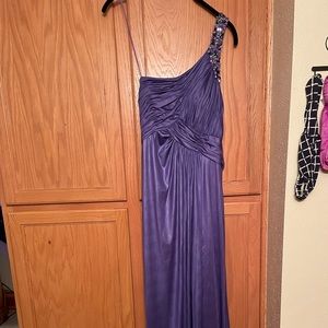 Beautiful formal gown. Beaded detail on the front and back with an open back